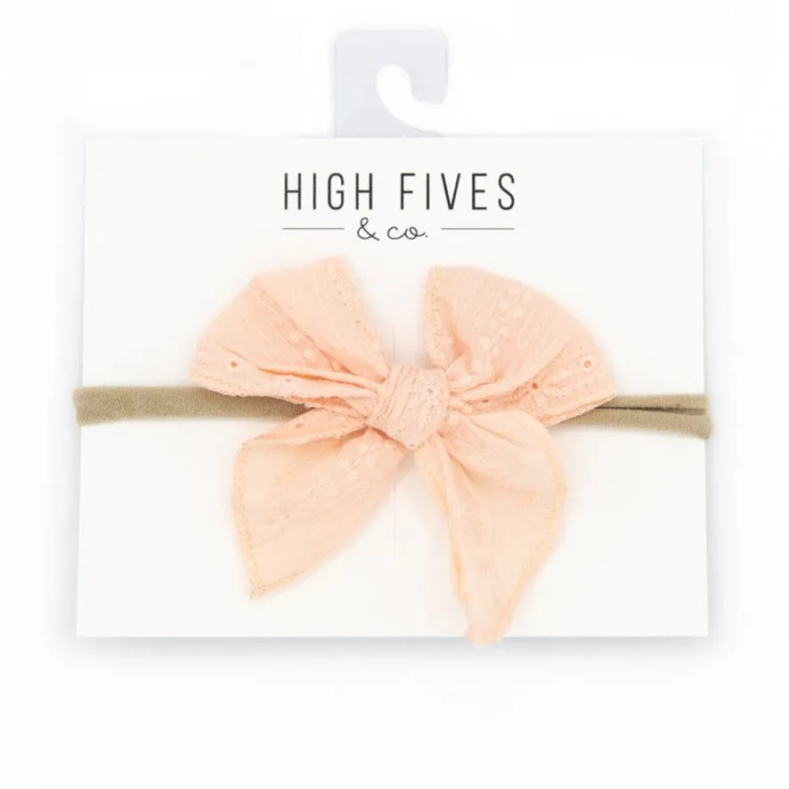 Eyelet Lace Bow with Pointed Tails on Nylon Headband